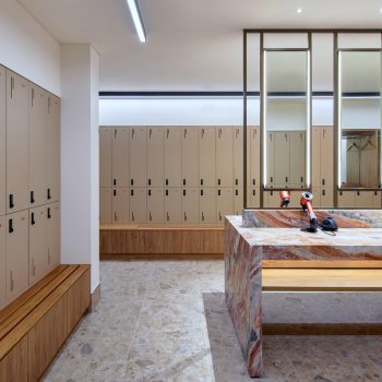 201 Elizabeth Street, Sydney, featuring premium end-of-trip facilities with secure personal lockers, bespoke timber bench seating, illuminated full-height mirrors, luxury stone grooming stations, and wellness-focused amenities designed to support active commuting, employee wellbeing, and an elevated workplace experience within Sydney CBD.