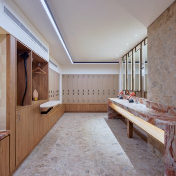 201 Elizabeth Street, Sydney, featuring premium end-of-trip facilities with bespoke timber joinery, natural stone finishes, luxury grooming stations, secure lockers, and wellness-focused amenities designed to support active commuting, employee wellbeing, and an elevated workplace experience within Sydney CBD.
