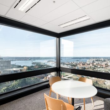201 Elizabeth Street, Sydney, featuring a premium corner meeting suite with floor-to-ceiling glazing, panoramic views over Hyde Park, St Mary’s Cathedral, Sydney Harbour, and the eastern suburbs skyline. Contemporary furnishings, abundant natural light, and uninterrupted outlooks create an exceptional workplace environment that supports collaboration, client meetings, and employee wellbeing within Sydney CBD.
